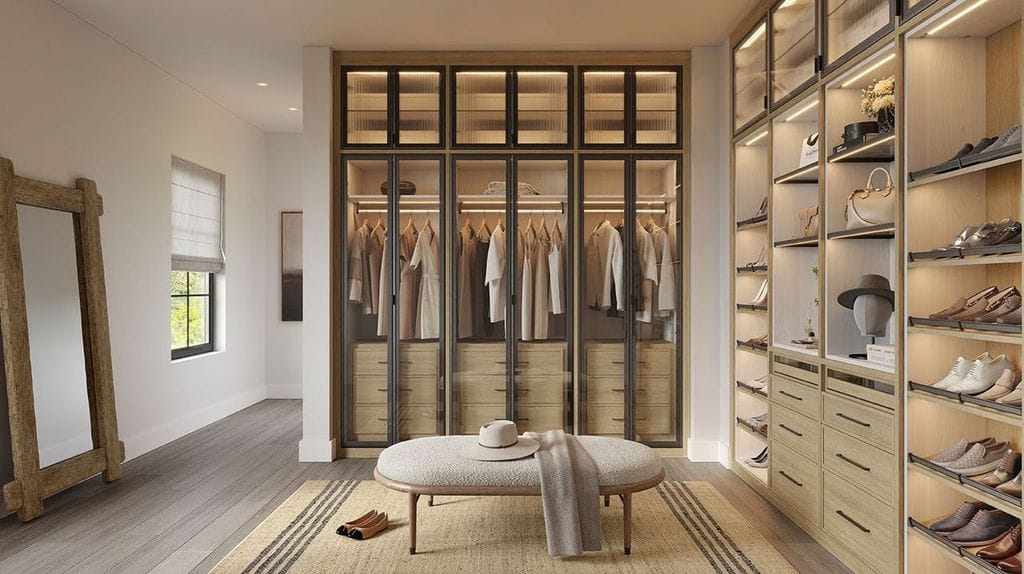 Walk in closet with custom shelving, dressers, and LED lighting by California Closets
