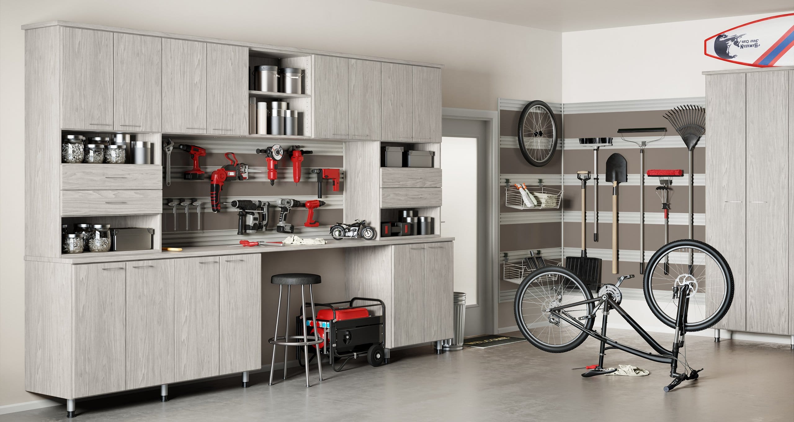 Light finish garage storage cabinets and countertop space for tools by California Closets